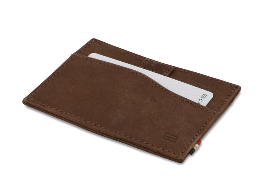 Front view of Leggera Card Holder Brushed in Brushed Brown with a pull tab with a card.