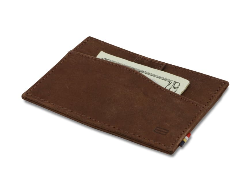 Front view of Leggera Card Holder Brushed in Brushed Brown with a pull tab with money.