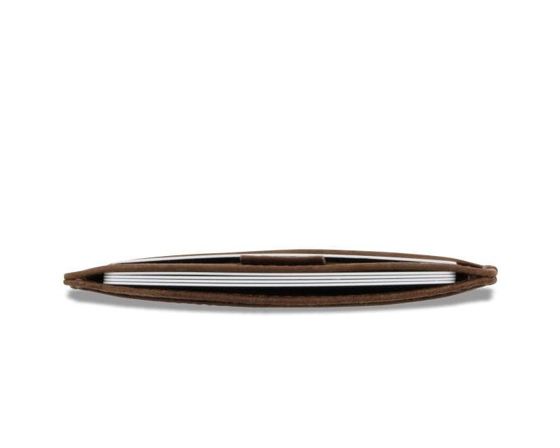 Above view of the Leggera Card Holder Brushed in Brushed Brown with cards inside.