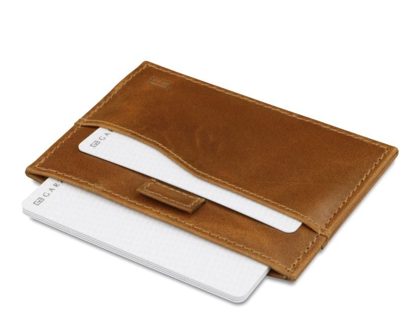 Open Leggera Card Holder Brushed in Brushed Cognac with cards pulling out.