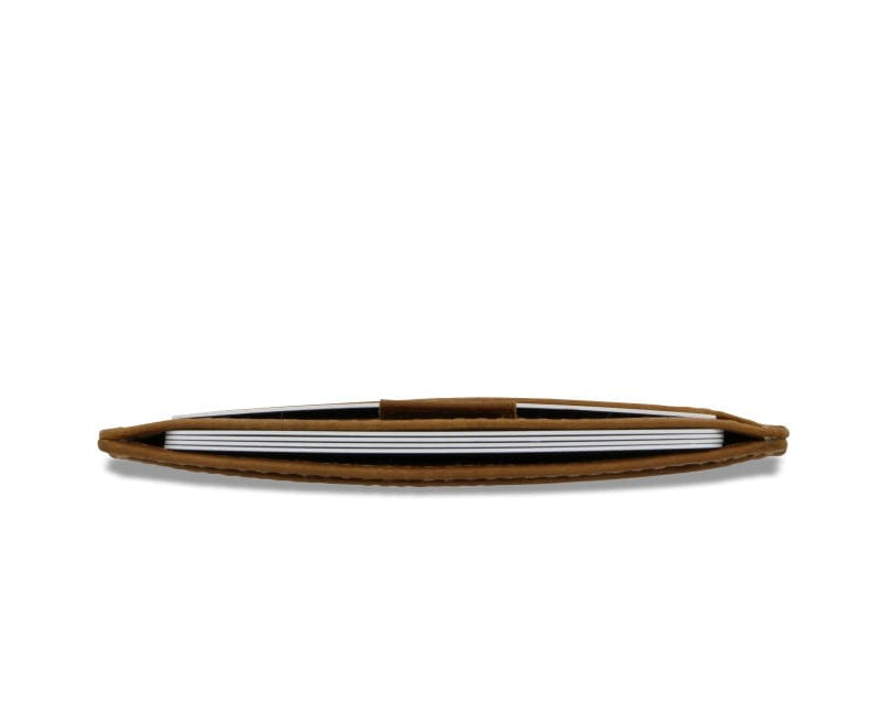 Above view of the Leggera Card Holder Brushed in Brushed Cognac with cards inside.