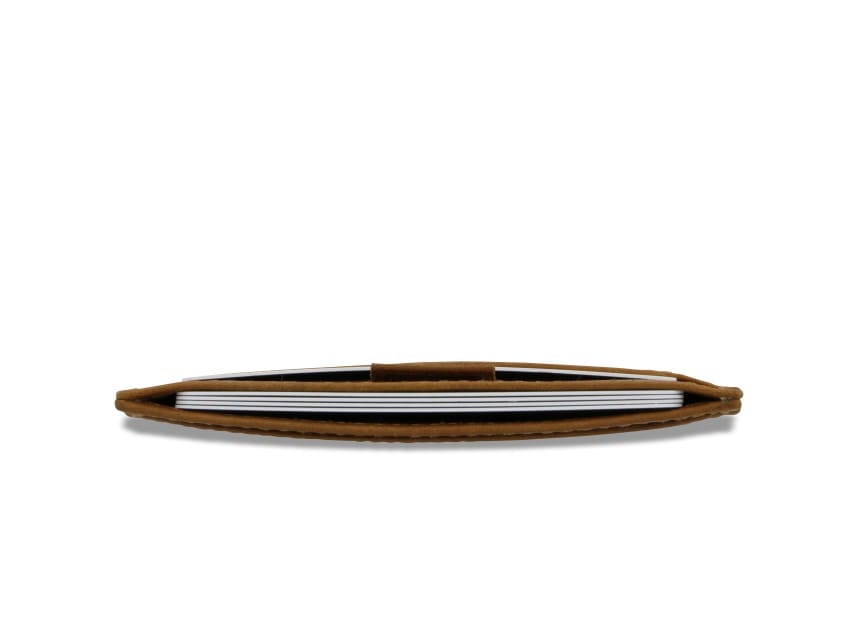 Above view of the Leggera Card Holder Brushed in Brushed Cognac with cards inside.
