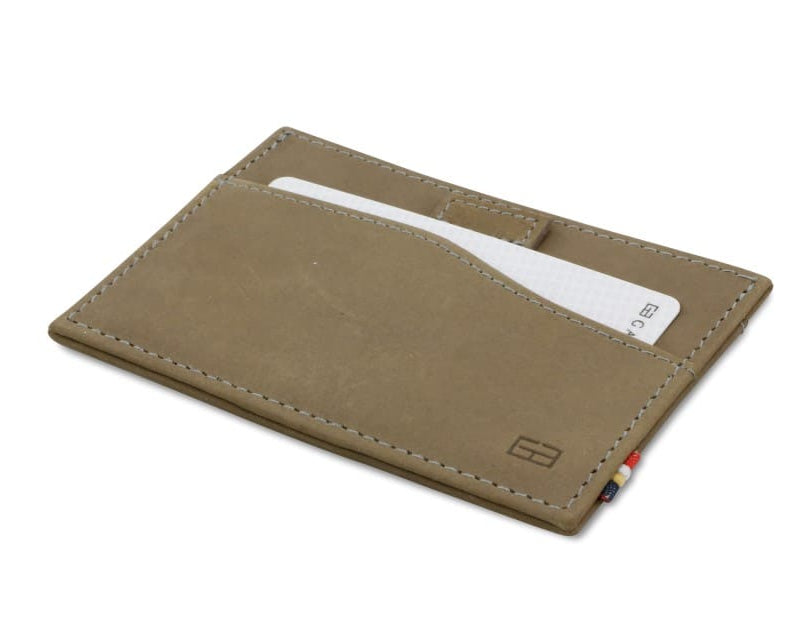 Front view of Leggera Card Holder Vintage in Metal Grey with a pull tab with a card.