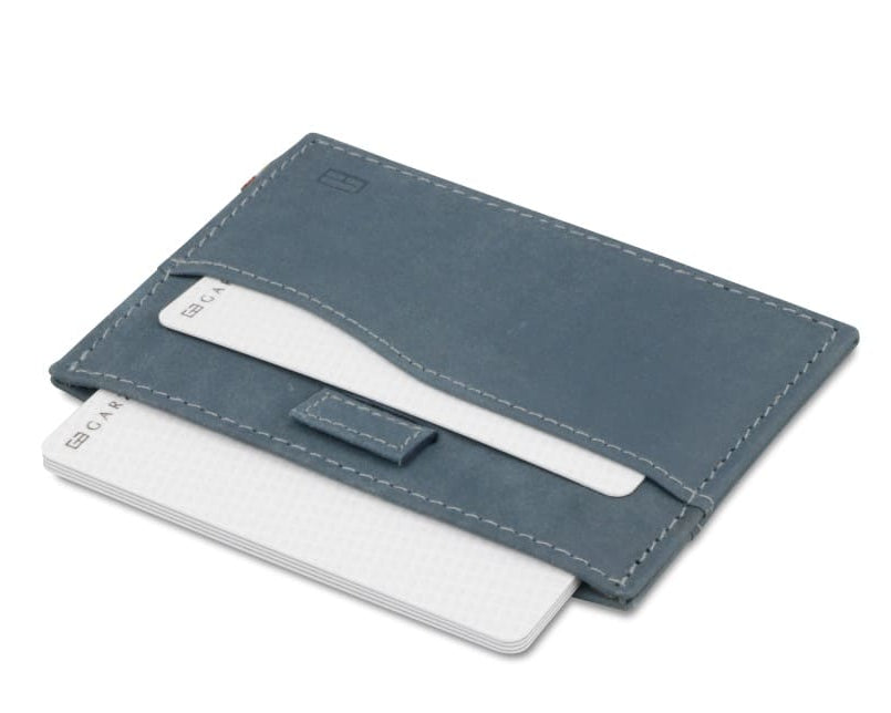 Open Leggera Card Holder Vintage in Sapphire Blue with cards pulling out.