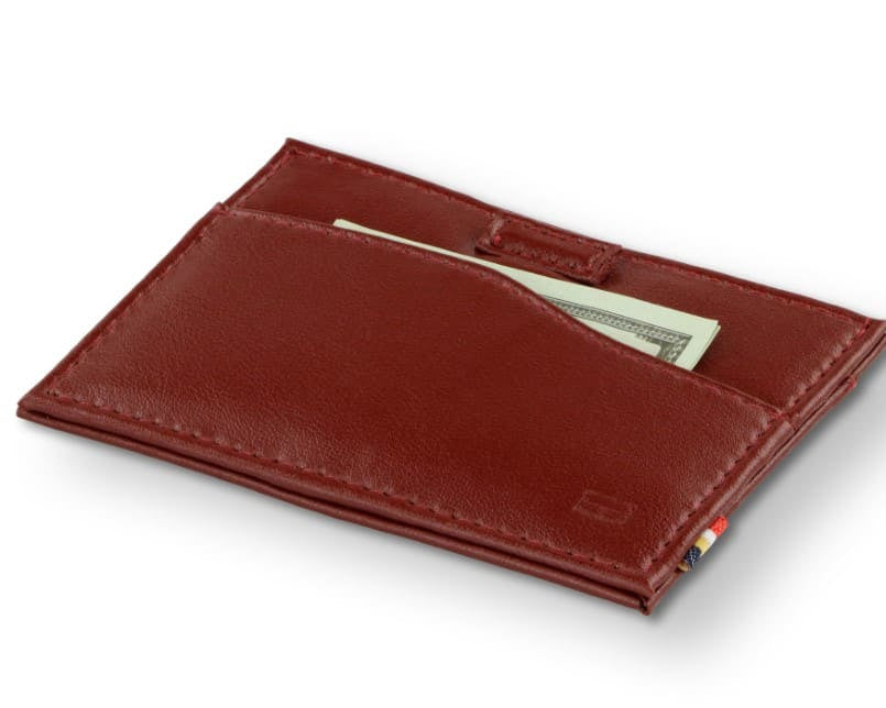 Front view of Leggera Card Holder Vegan in Cactus Burgundy with a pull tab with money.