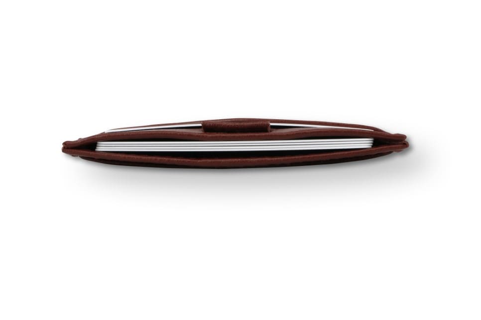 Above view of the Leggera Card Holder ID Window Vegan in Cactus Burgundy with cards inside.