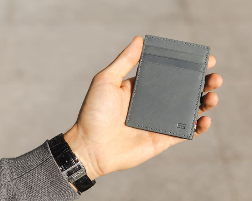 hand holding the Cavare Magic Coin Wallet