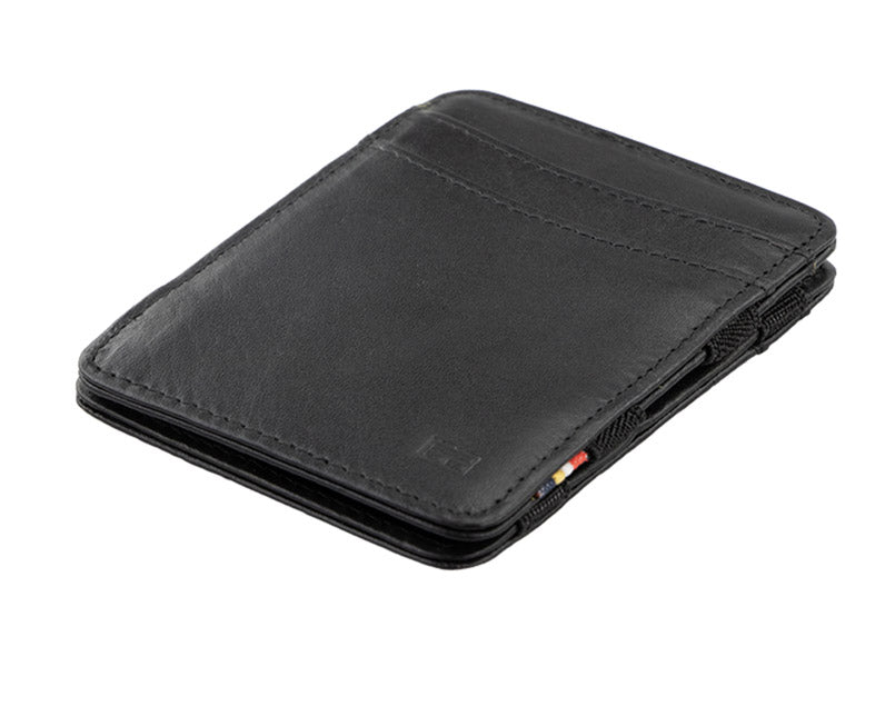 Garzini Urban Magic Wallet in black leather, showing the front side from a sideways angle.