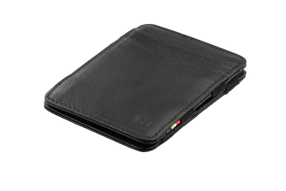 Garzini Urban Magic Wallet in black leather, showing the front side from a sideways angle.