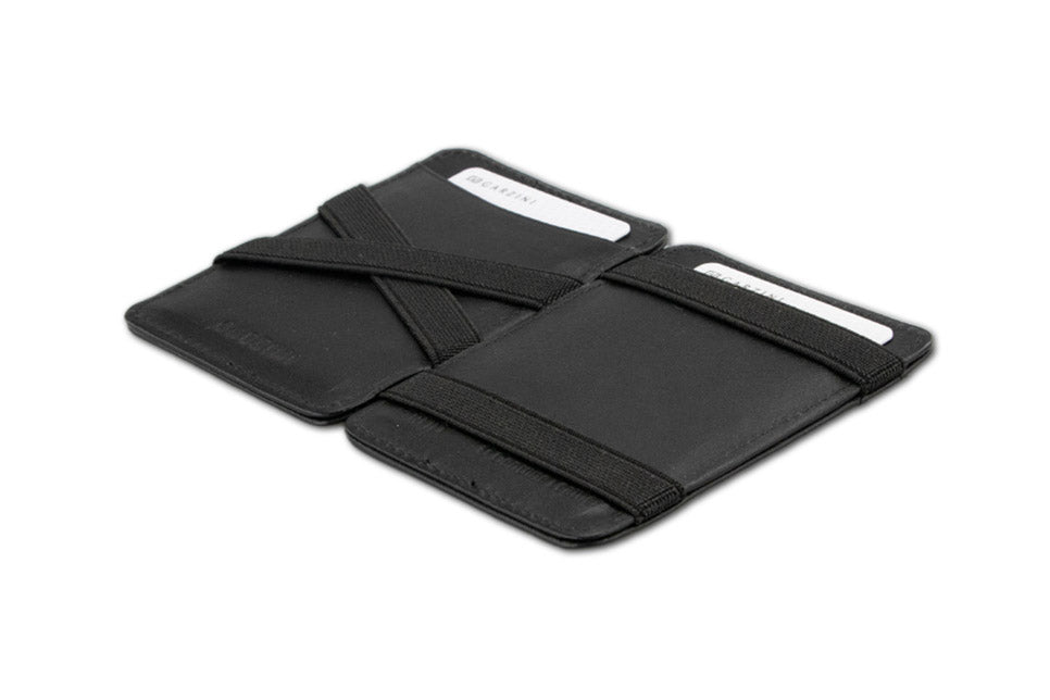 Opened Garzini Urban Magic Wallet in black leather, displaying the card slots and storage compartments.