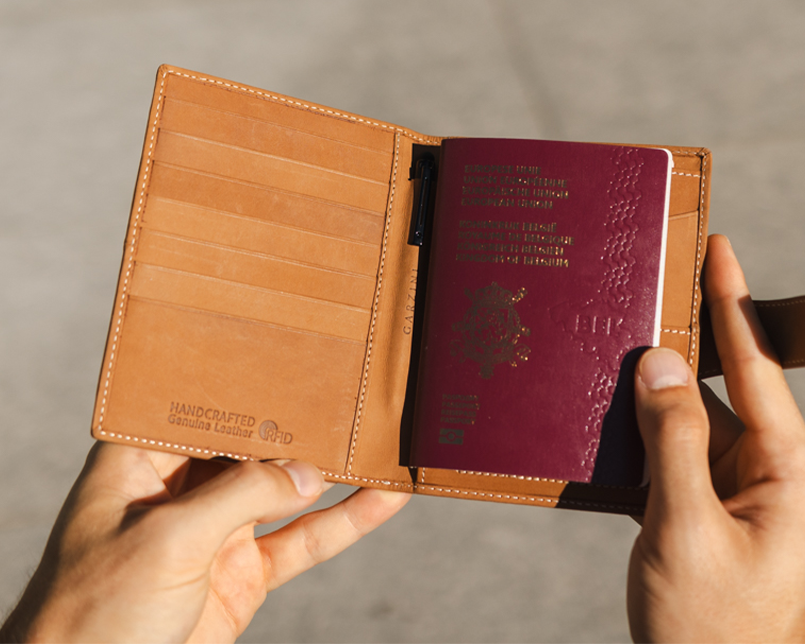 Two hands holding the Vintage Camel Brown open.