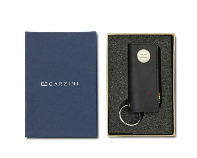 Front view of the Lusso Vintage Key Holder in Brushed Black in the box with the brand name Garzini.