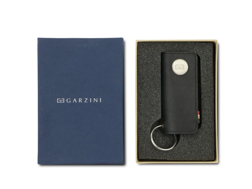 Front view of the Lusso Vintage Key Holder in Brushed Black in the box with the brand name Garzini. 