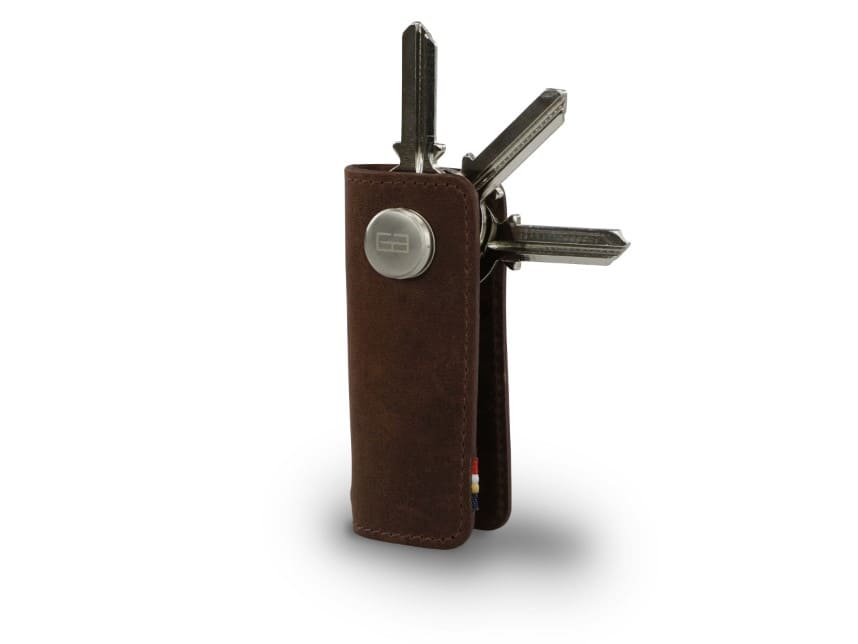 Side view of Lusso Vintage Key Holder in Brushed Brown with with a key holder ring and 3 keys. 