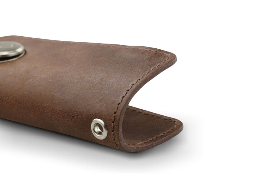 Close up view of the bottom side in Brushed Brown with a key holder hole for a key holder ring.
