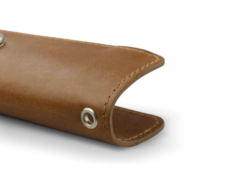 Close up view of the bottom side in Brushed Cognac with a key holder hole for a key holder ring.