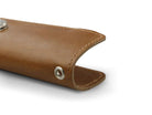 Close up view of the bottom side in Brushed Cognac with a key holder hole for a key holder ring.