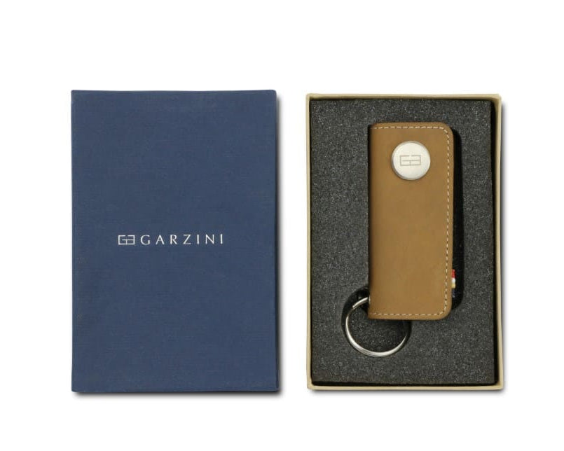 Front view of the Lusso Key Holder in Camel Brown in the box with the brand name Garzini.
