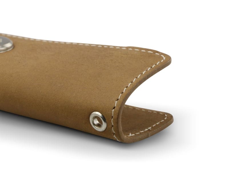 Close up view of the bottom side in Camel Brown with a key holder hole for a key holder ring.