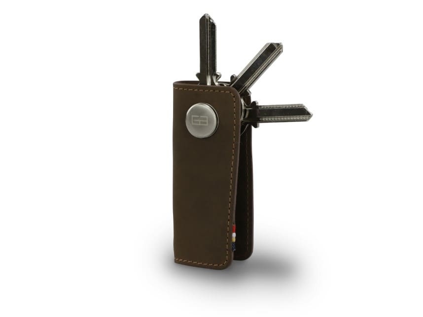 Side view of Lusso Key Holder in Java Brown with with a key holder ring and 3 keys.