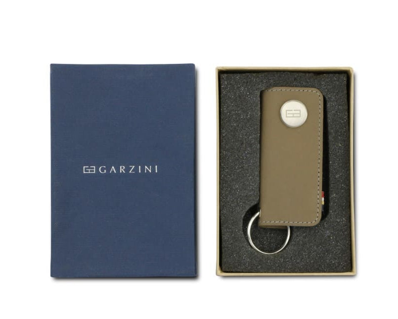 Front view of the Lusso Key Holder in Metal Grey in the box with the brand name Garzini.