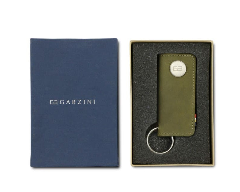 Front view of the Lusso Key Holder in Olive Green in the box with the brand name Garzini.
