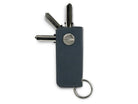 Back view of Lusso Key Holder in Sapphire Blue with with a key holder ring and 3 keys.