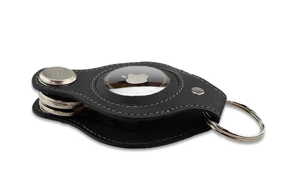 Side view of Lusso AirTag Key Holder in Carbon Black with a key holder ring.