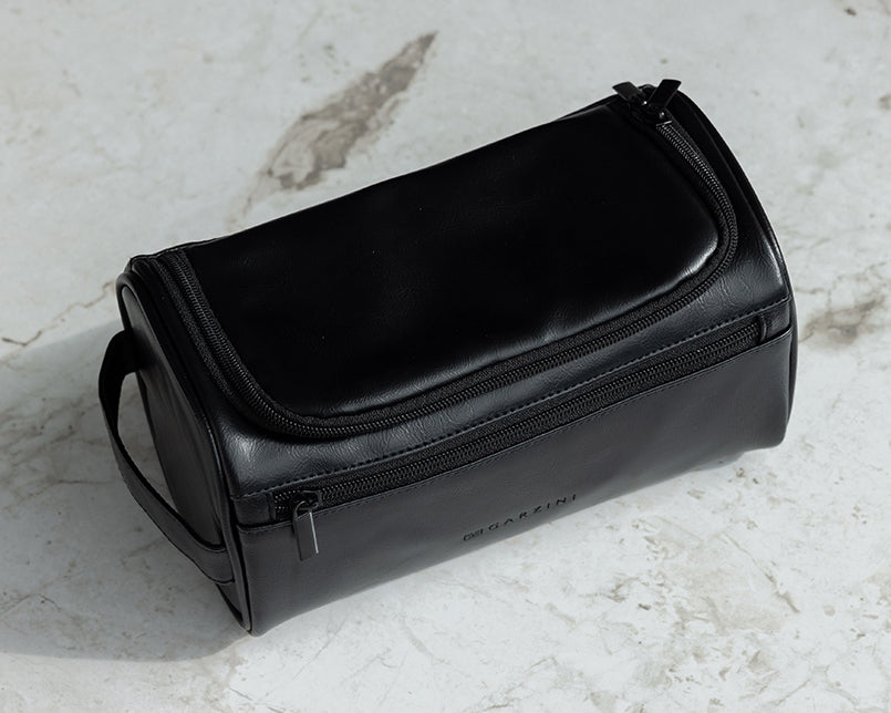 Black Garzini Toiletry Bag in a stylish bathroom lifestyle setting, perfect for organizing travel essentials.