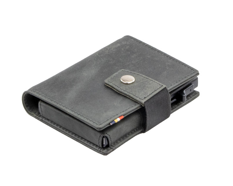 Closed Garzini Metal Wallet in brushed black leather with push button, viewed from an angle