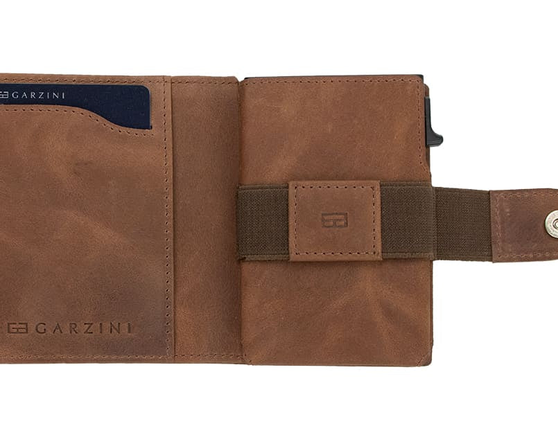 Open Garzini Metal Wallet in brushed brown leather, displaying card and cash slots