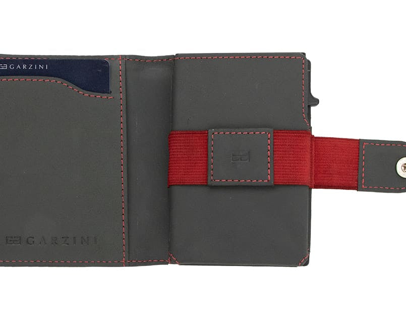 Open Garzini Metal Wallet in carbon red leather, displaying card and cash slots