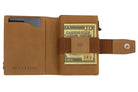 Open Garzini Metal Wallet in camel brown leather, holding a stack of cash