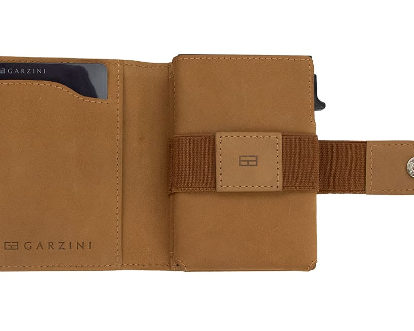 Open Garzini Metal Wallet in camel brown leather, displaying card and cash slots