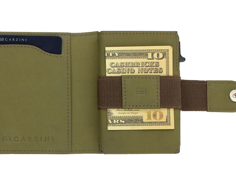 Open Garzini Metal Wallet in olive brown leather, holding a stack of cash