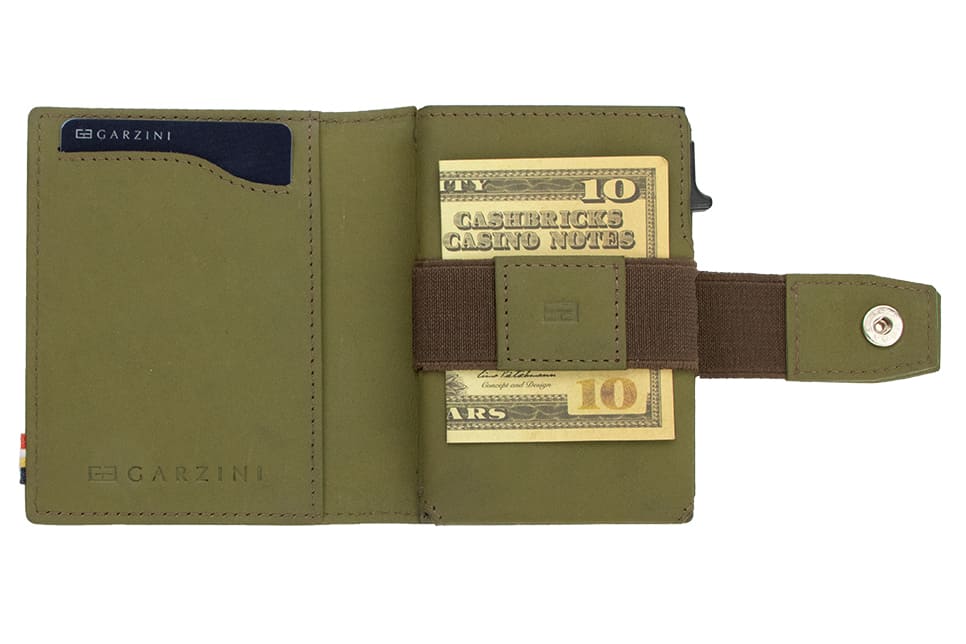 Open Garzini Metal Wallet in olive brown leather, holding a stack of cash