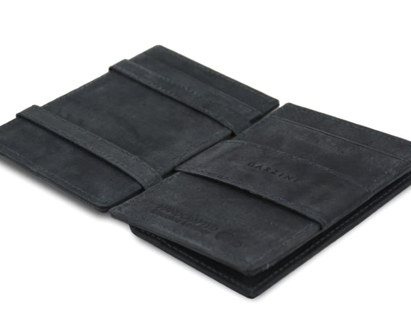 Open view of the  Essenziale Magic Coin Wallet in Carbon Black with the money strap to secure money.