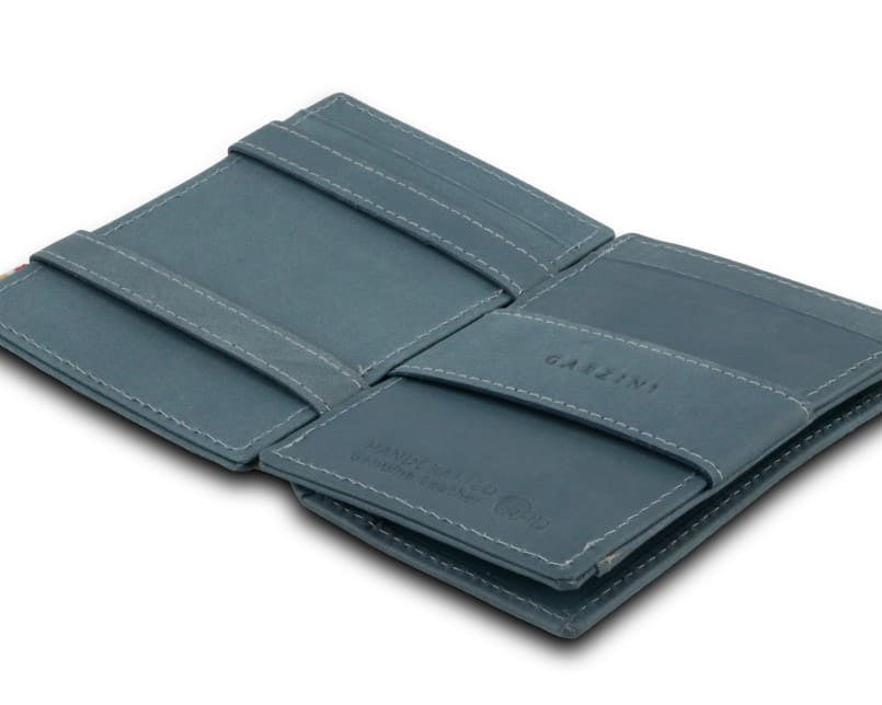 Open Cavare Magic Coin Wallet Card Sleeve Vintage  in Sapphire Blue with pull tab, back coin pocket, and money straps.