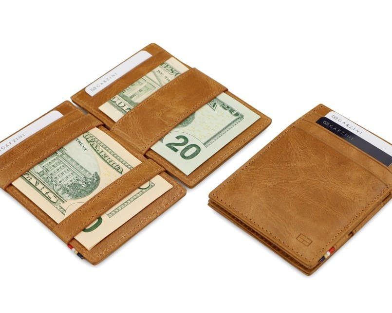 Front and open view of Essenziale Magic Wallet Brushed in Brushed Cognac with pull tab, coin pocket, and money straps.