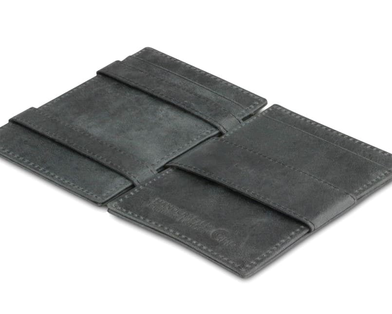 Open view of the Essenziale Magic Wallet ID Window Brushed in Brushed Black with the money strap to secure money.