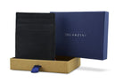 Half-open blue box with Garzini brand name. Inside the box, the Carbon Black wallet is wrapped in tissue paper, placed in a light cardboard box with a blue strap