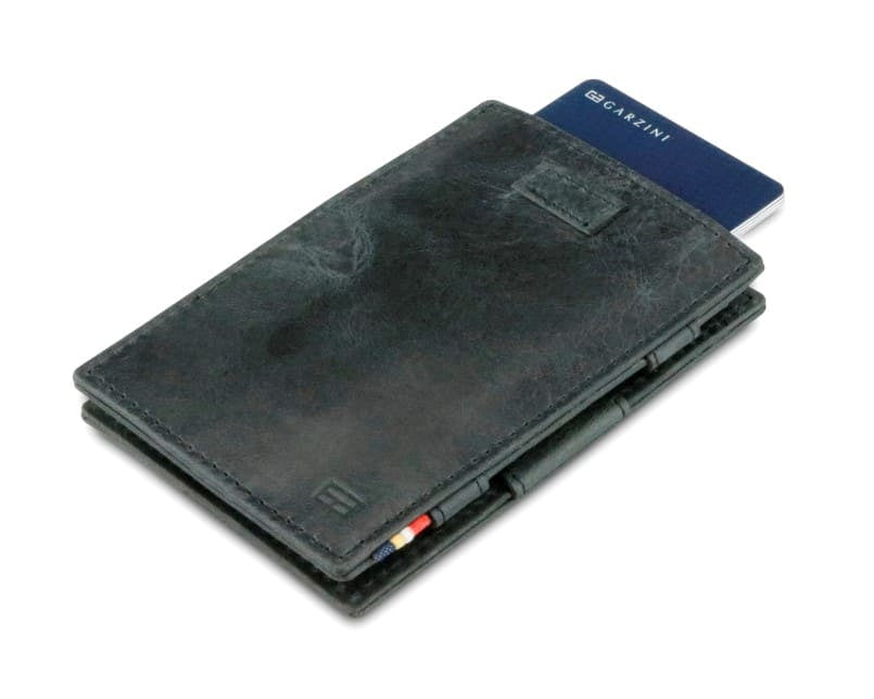 Front view of Cavare Magic Wallet Brushed in Brushed Black with pull tab and card pulling out.