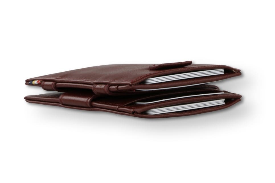 Side view of the Cavare Magic Wallet Card Sleeve Cactus in Cactus Burgundy with cards inside.