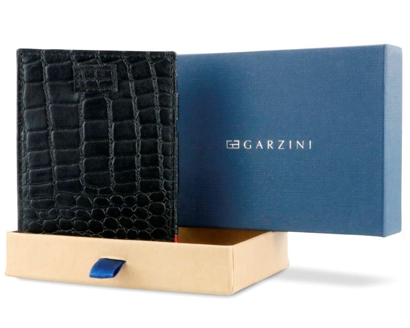 Half-open blue box with Garzini brand name Inside the box, the Garzini wallet is wrapped in tissue paper, placed in a light cardboard box with a blue strap.