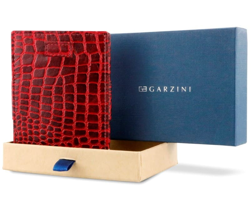 Half-open blue box with Garzini brand name Inside the box, the Garzini wallet is wrapped in tissue paper, placed in a light cardboard box with a blue strap.