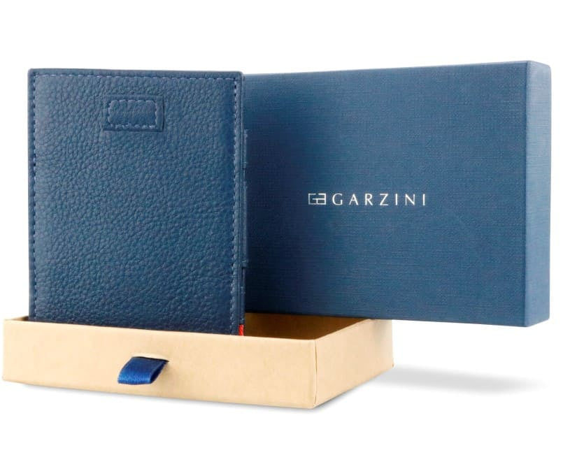 Half-open blue box with Garzini brand name Inside the box, the Garzini wallet is wrapped in tissue paper, placed in a light cardboard box with a blue strap.