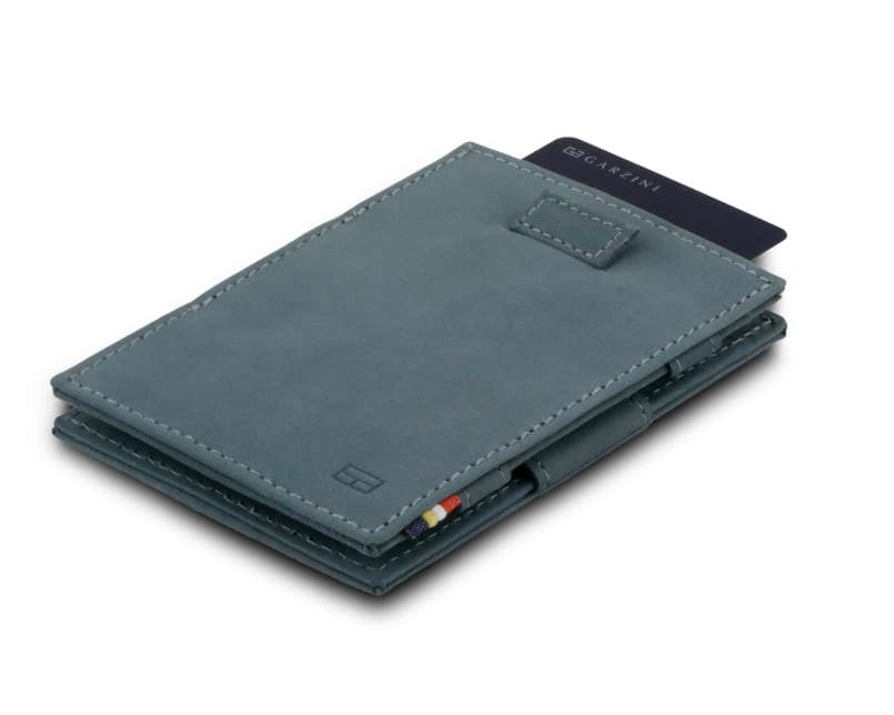 Front view of Cavare Magic Wallet Vintage in Sapphire Blue with pull tab and card pulling out.