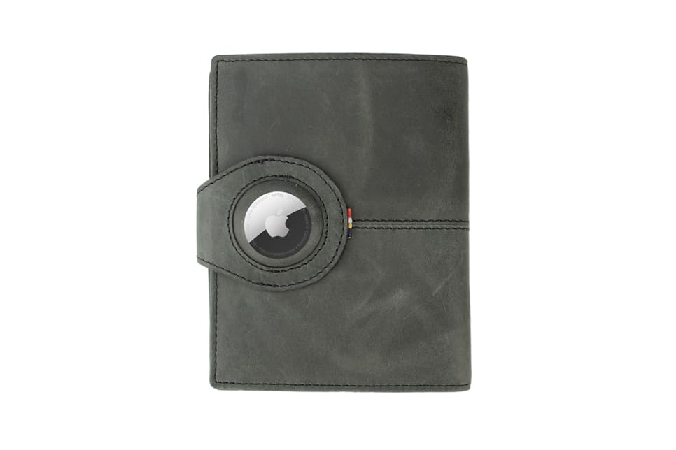 Backview with the AirTag of the AirTag Passport Holder in Brushed Brushed Black.