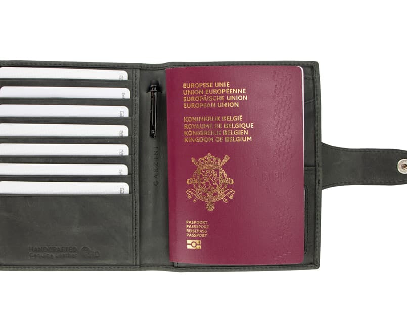 Open view of the AirTag Passport Holder in Brushed Brushed Black with cards and passport inside.