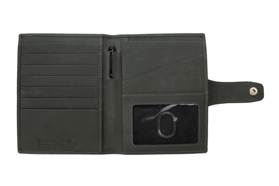 Open view of the AirTag Passport Holder in Brushed Brushed Black with no cards.